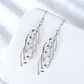 Aretes Solenne Onda Tejida | Oro blanco