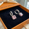 Aretes Huggie Rosa Brillante | Oro blanco