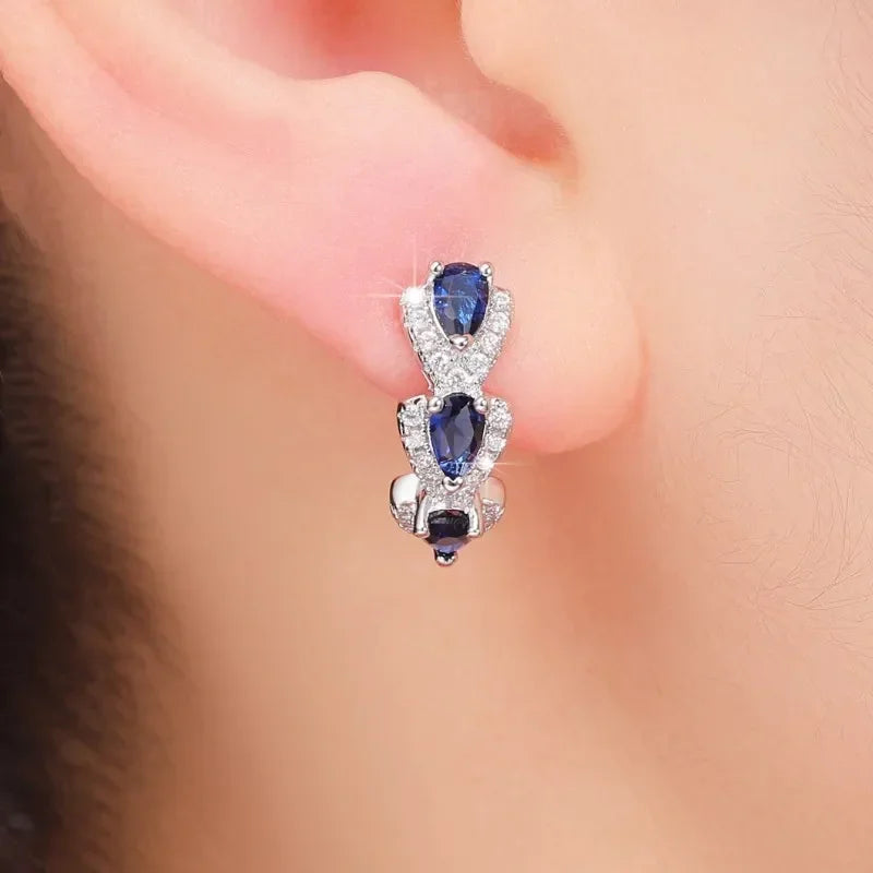 Aretes Escudo Zafiro Real | Oro blanco