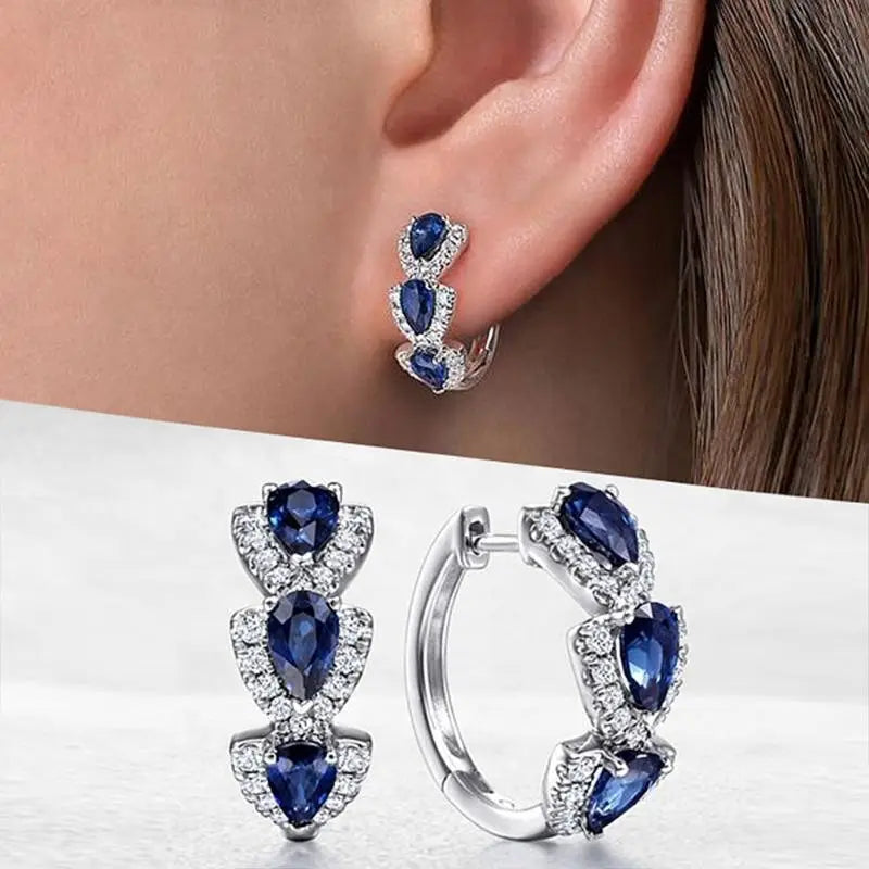 Aretes Escudo Zafiro Real | Oro blanco