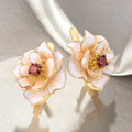 Aretes Flor Blanca Circonia Roja | Oro